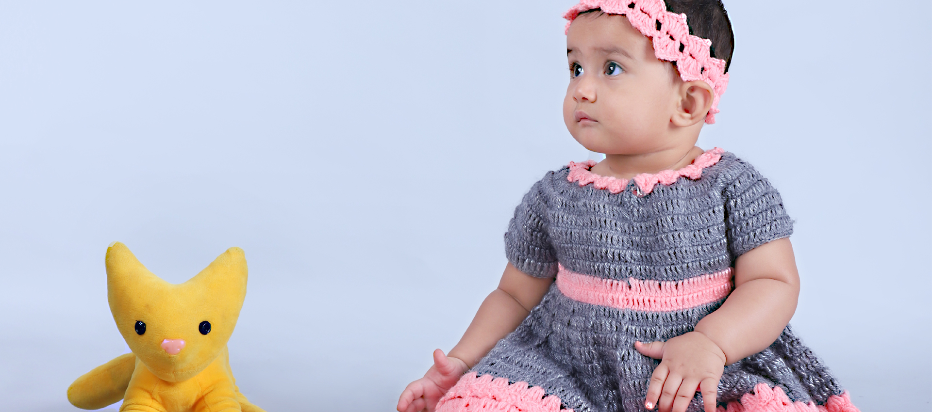 baby wearing crochet frock