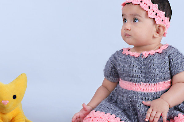 baby wearing crochet frock
