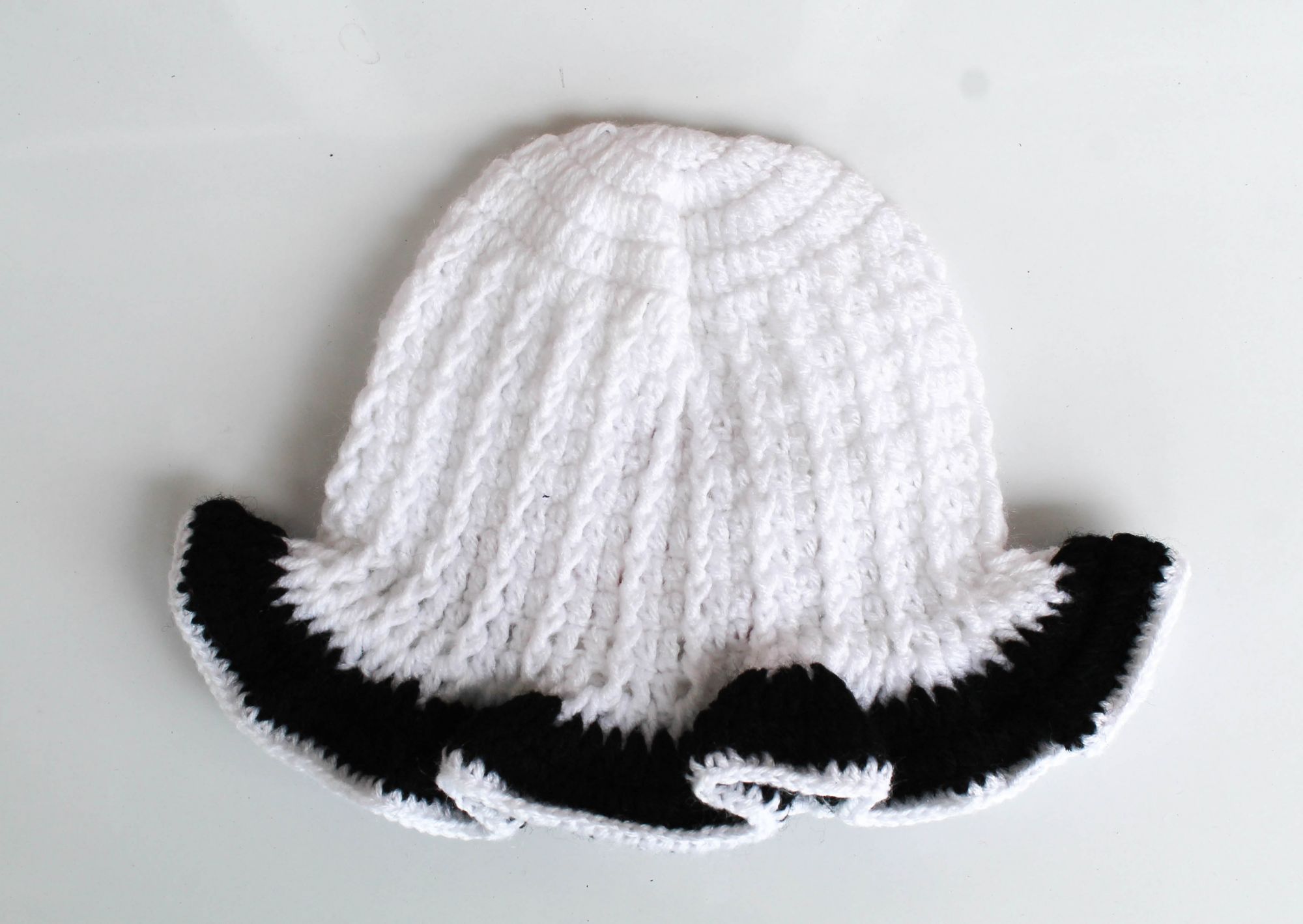 White and Black Floral Woolen Cap for Infants