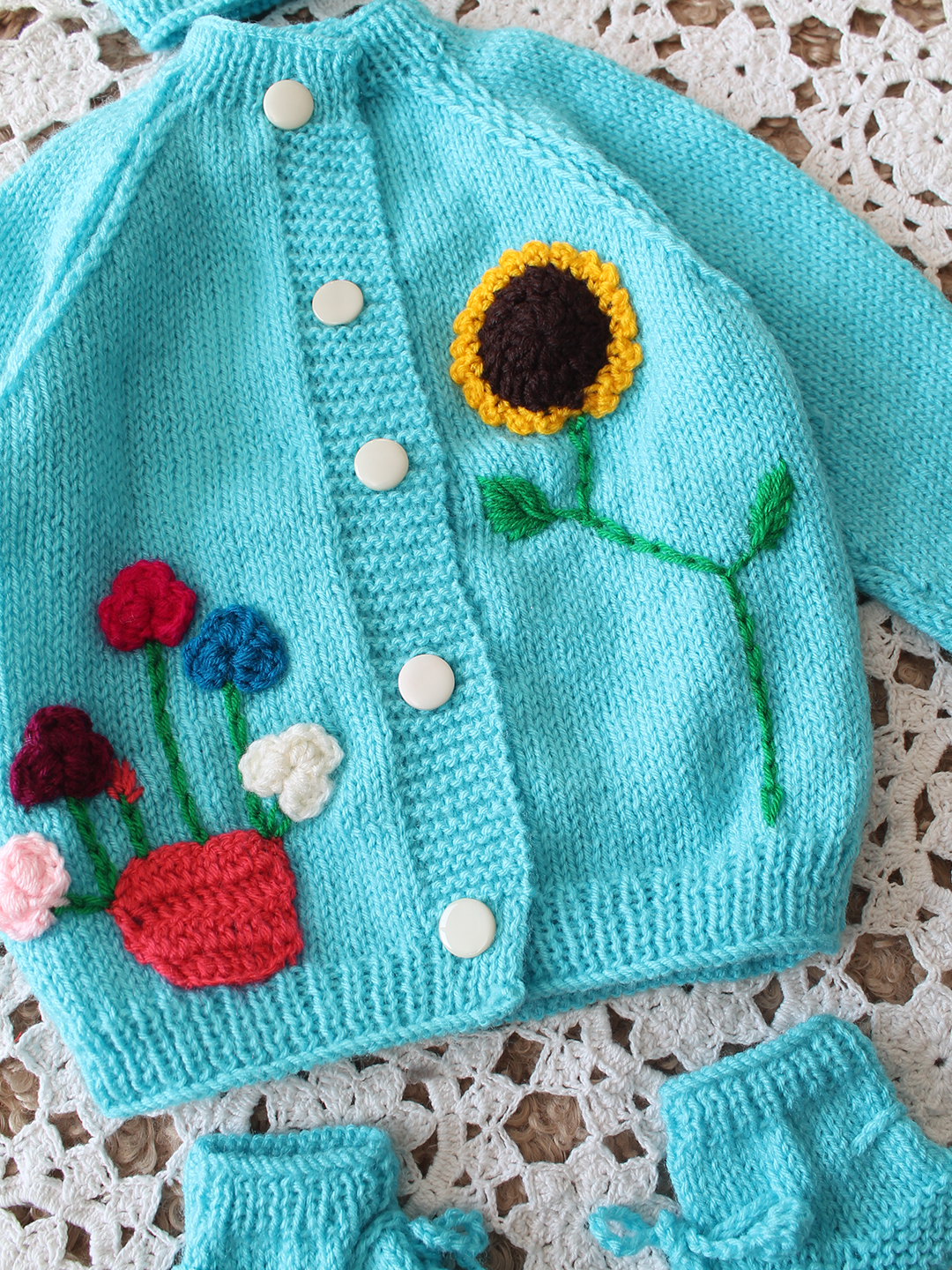 Woonie Handknitted Full Sleeves Floral Applique Cardigan Set with Cap and Booties - Light Blue