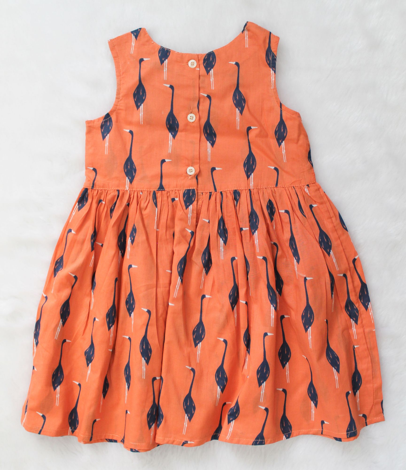 Woonie Sleeveless Swan Printed Frock-Orange