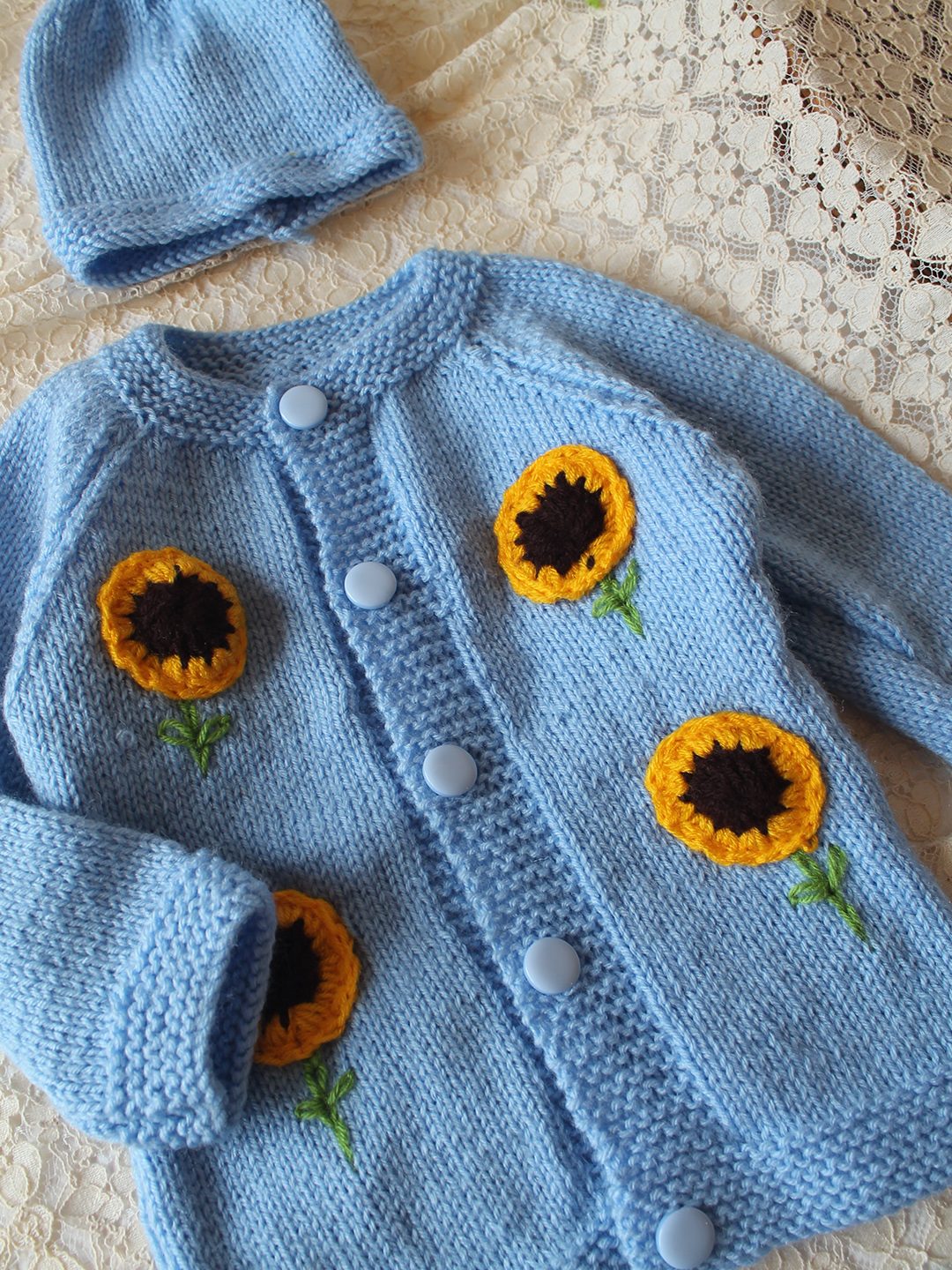 Woonie Handknitted Full Sleeves Sunflower Applique Detailed Cardigan with Cap & socks - Sky Blue