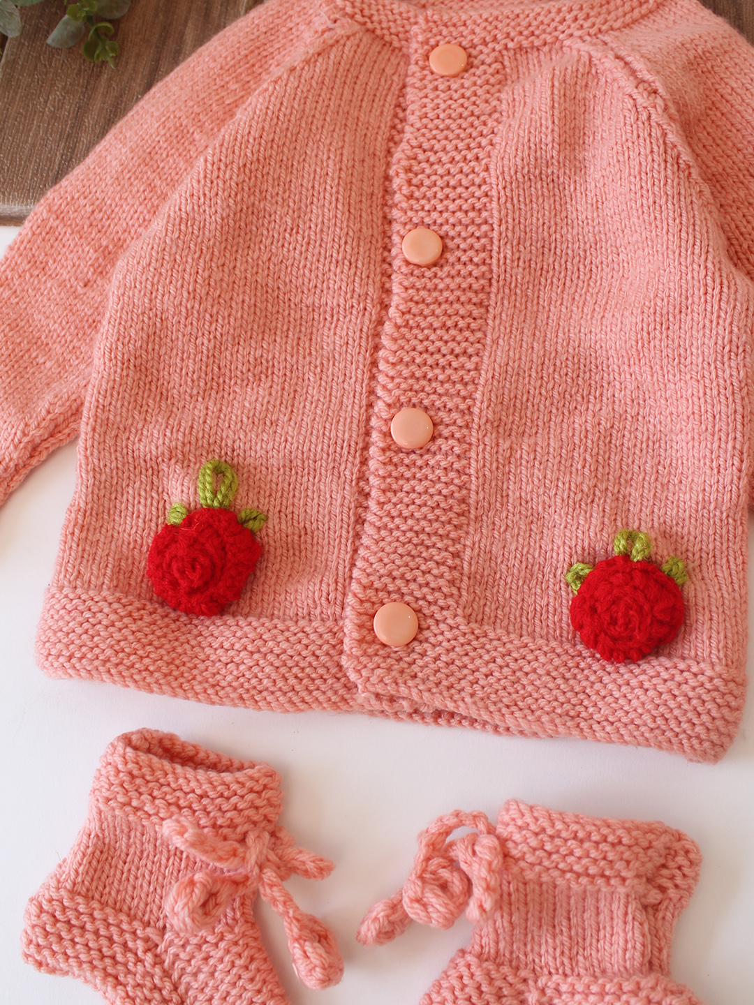 Woonie Handknitted Full Sleeves Floral Appliques Detailed Cardigan with Cap & Socks - Peach
