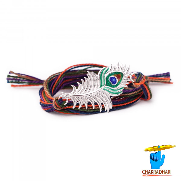 Image of Elegant Grace: Peacock Feather Design Silver Rakhi