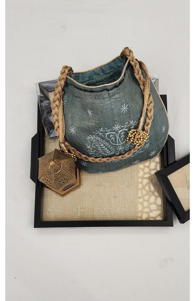 Image of Bottle Green Chikankari Potli Bag in Monga Silk | Rohia By Chhangamal
