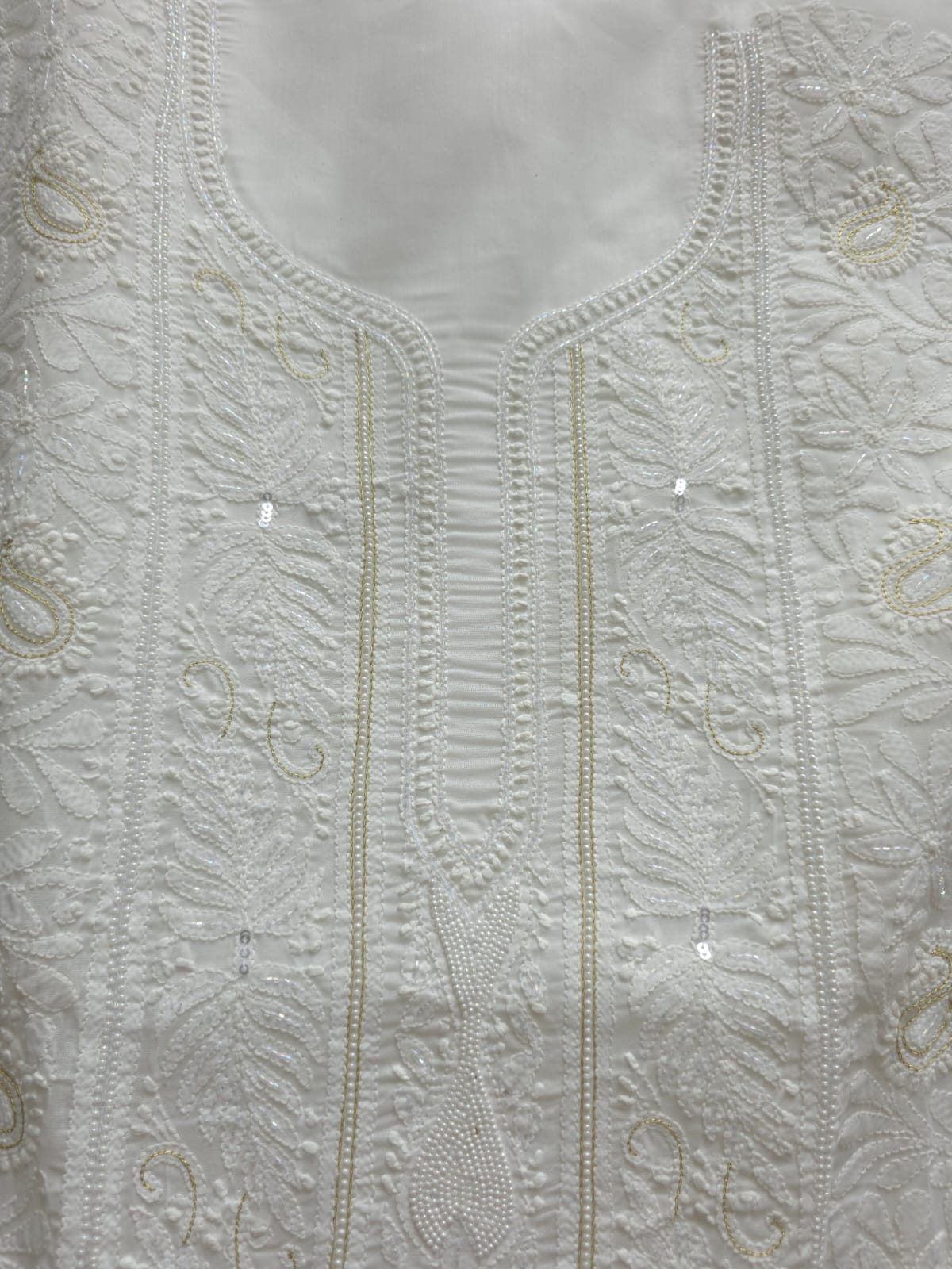 Pristine White suit with exquisite jaal chikan and heavy pearl cutdana