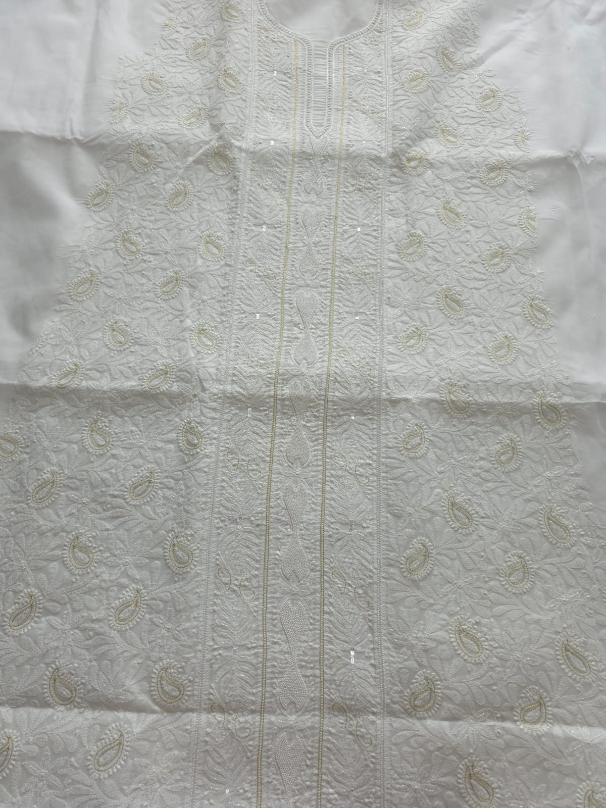 Pristine White suit with exquisite jaal chikan and heavy pearl cutdana