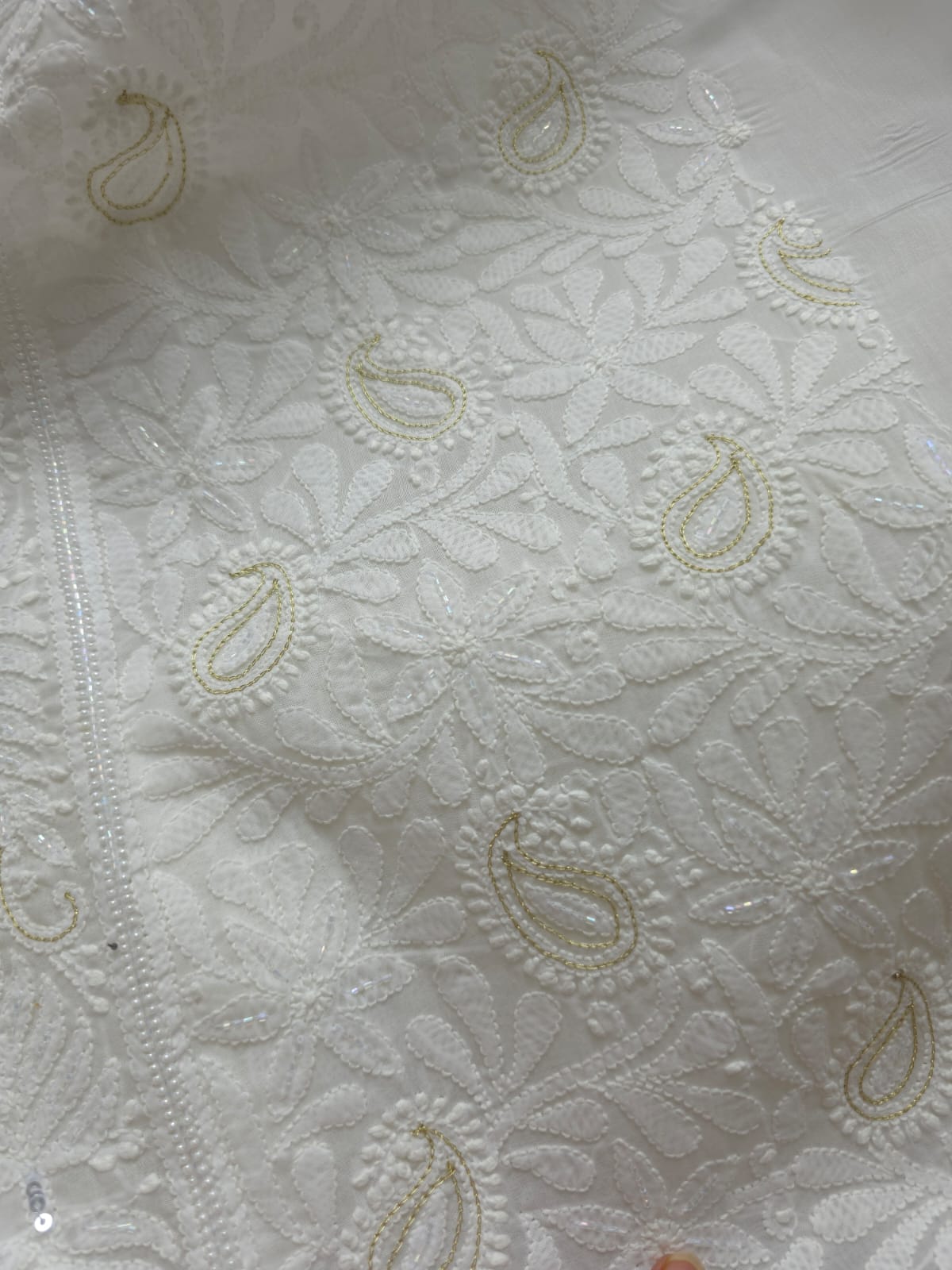 Pristine White suit with exquisite jaal chikan and heavy pearl cutdana