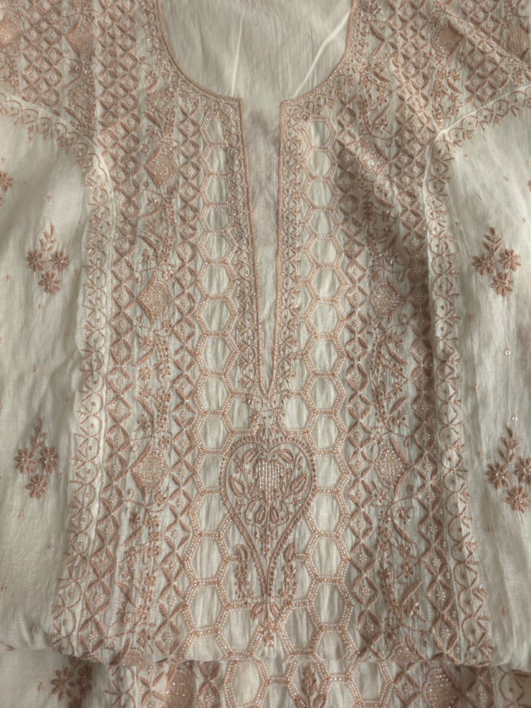 Image of White base Semistitched kurta dupatta with fine hazelnut chikankari and heavy embellishments