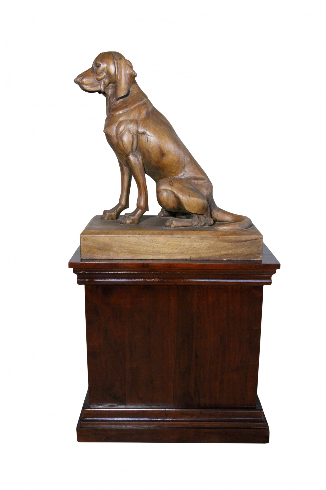 Wooden dog on pedestal