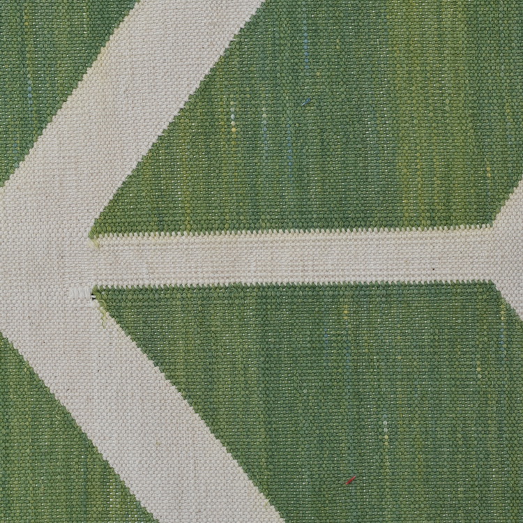 Geometric white and green rug