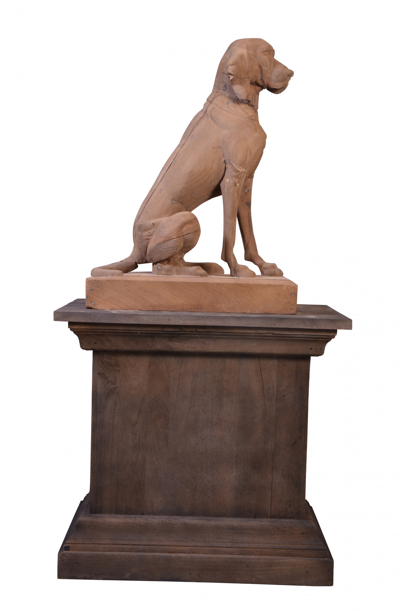 Wooden dog on pedestal