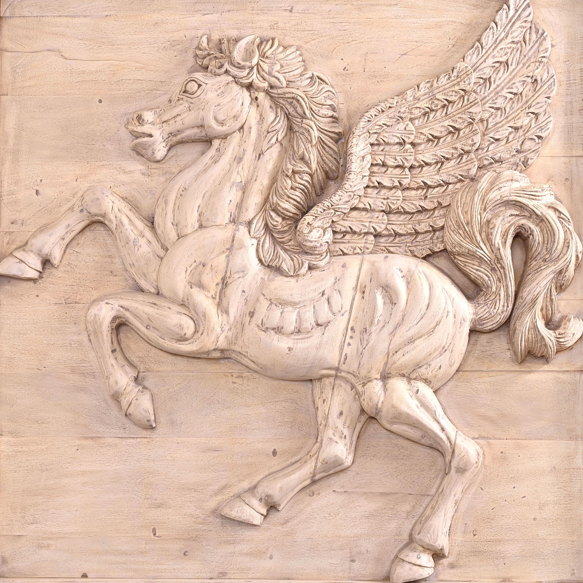 hand-carved wooden horse mural