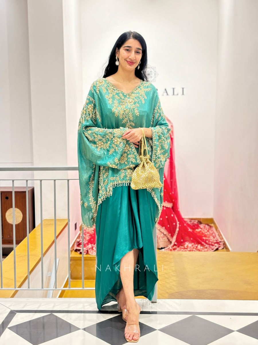 Trendy teal green saree with modern drape style