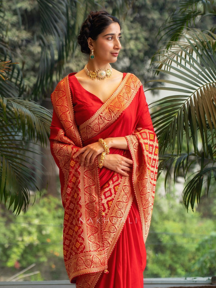 Classic red saree with golden ethnic design