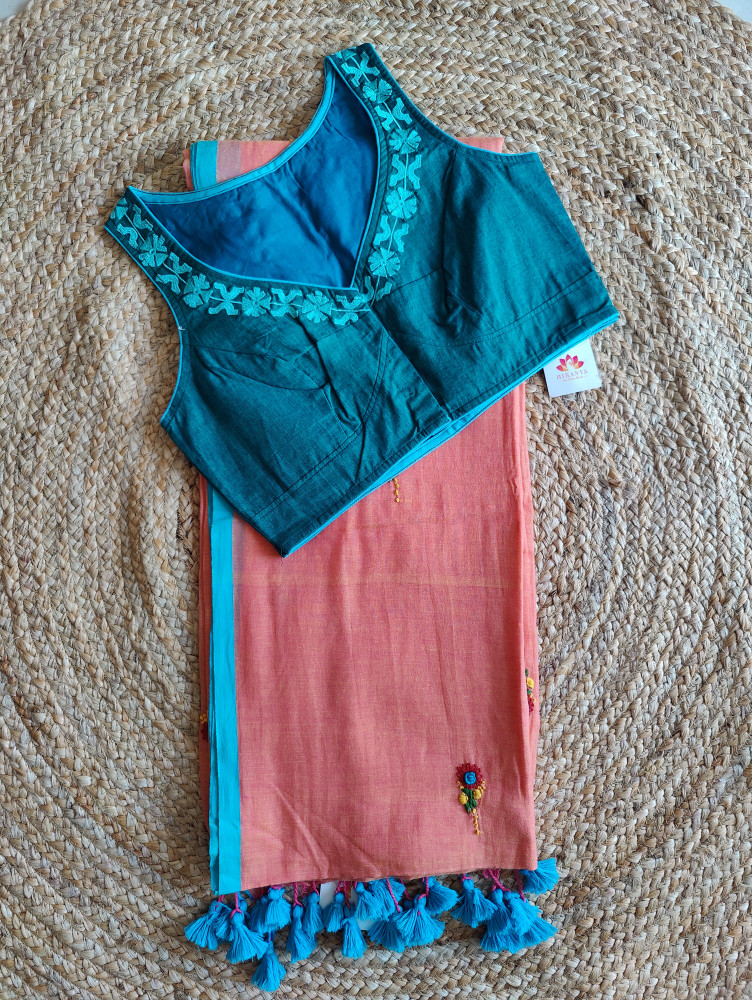 Image of Orange hand embroidered saree with turquoise sleeveless blouse