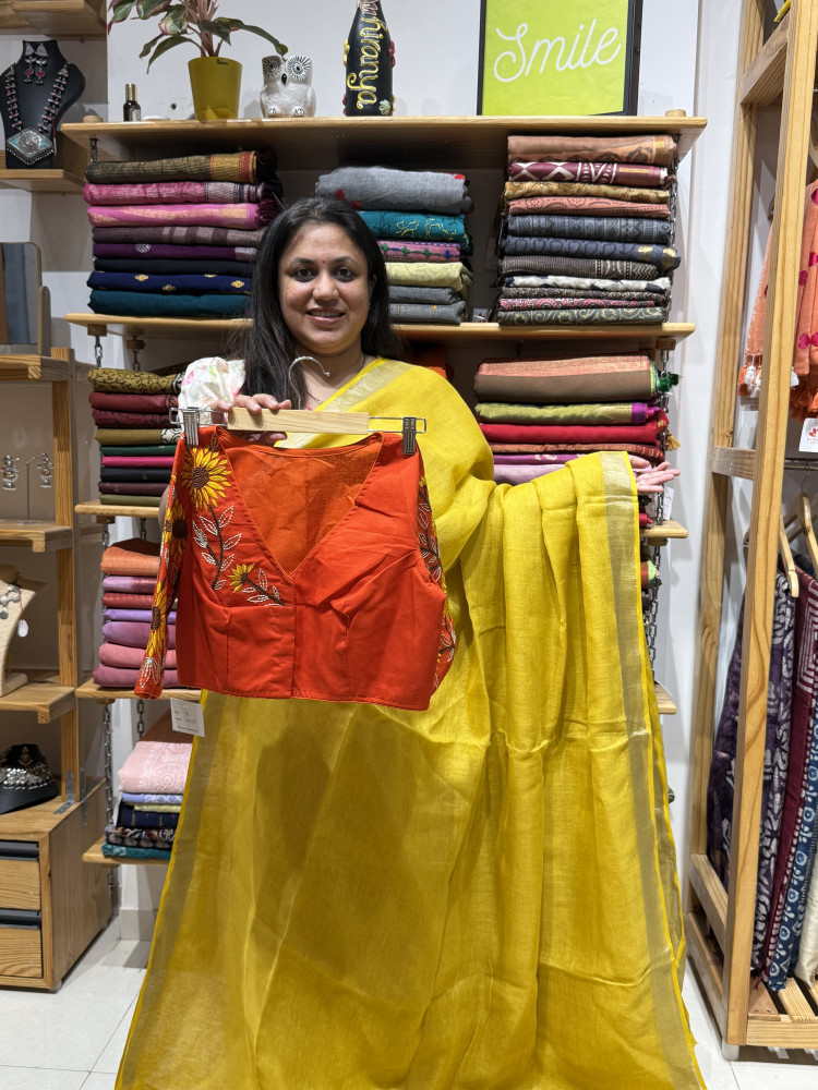 Image of Yellow Pure linen Saree with orange sunflower blouse