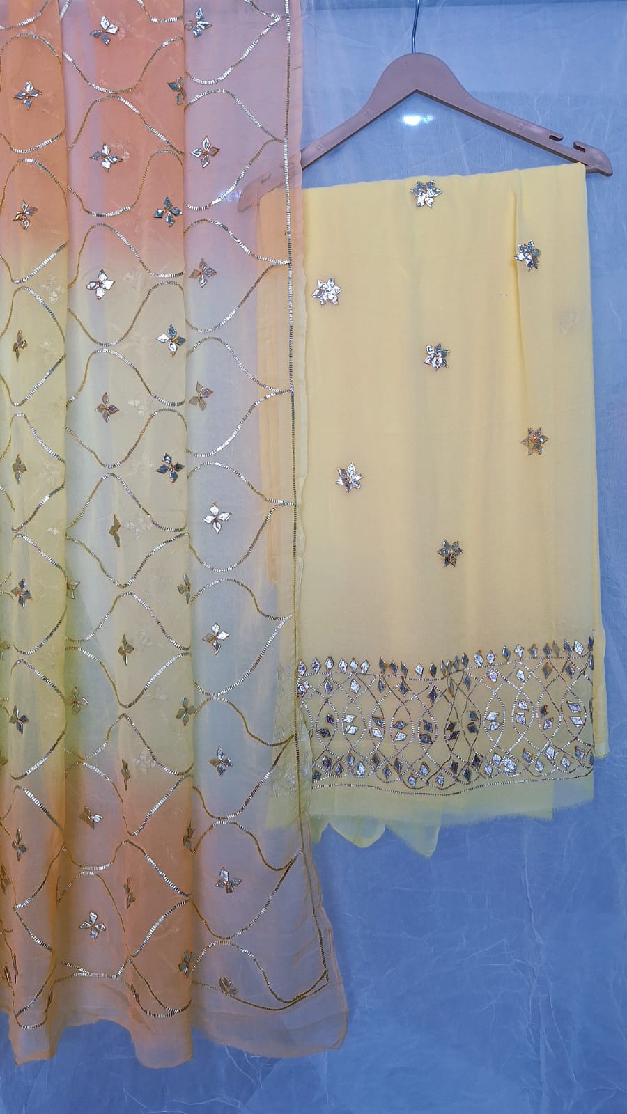 LIGHT YELLOW GEORGETTE SUIT WITH SHIFFON LIGHT YELLOW KESARI SHADED DUPPTTA AND SANTOONPANT UNSTITCHED