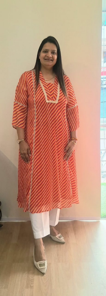 Image of ORANGE RED LEHRIYA CHINON KURTI WITH WHITE PANTS