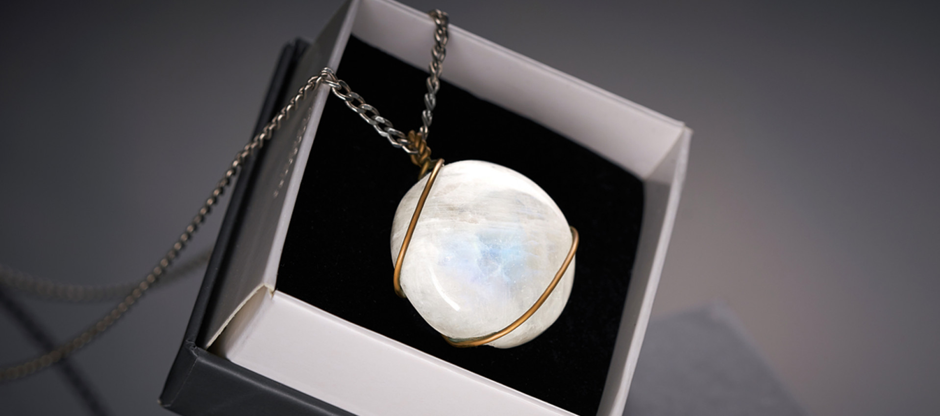 Moonstone with chain in black background