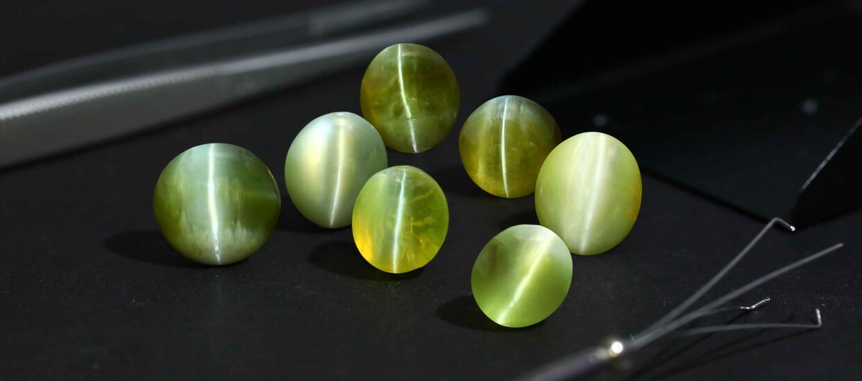 thumbnail interactive-video image 1 of Multi-Color Cat's Eye Stone Ear Plugs - Wooden Flesh Tunnel Stretcher Gauges (Pair) 1 of 2