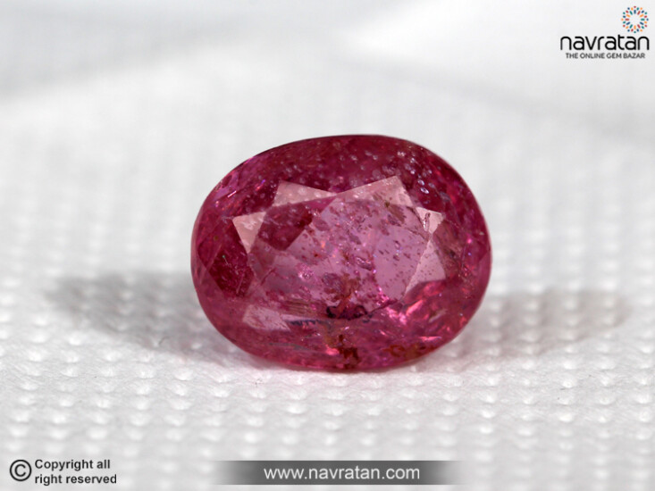 Ruby gemstone on the white background