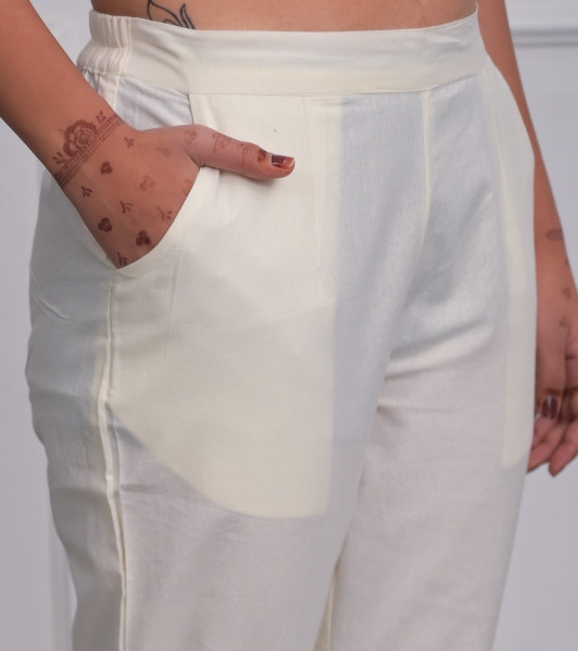 Off White Solid Cotton Pants With Partially Elasticated Waistband And Two Side Pockets