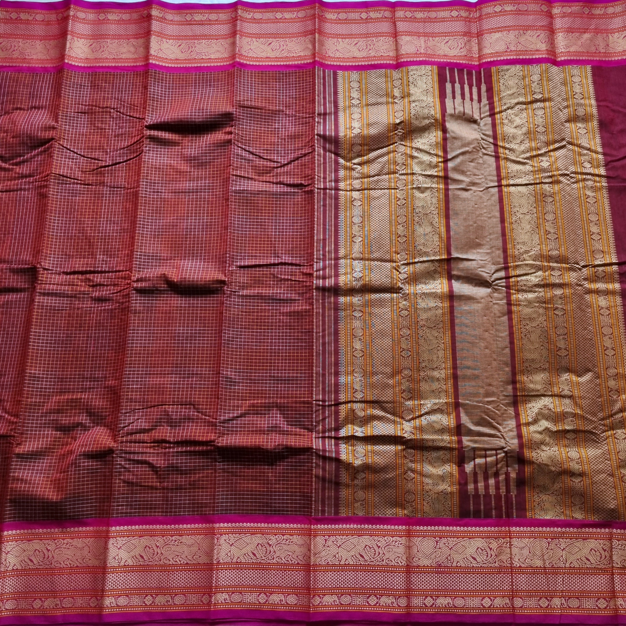 Kanchi Cotton maroonish brown checked saree with intricate borders