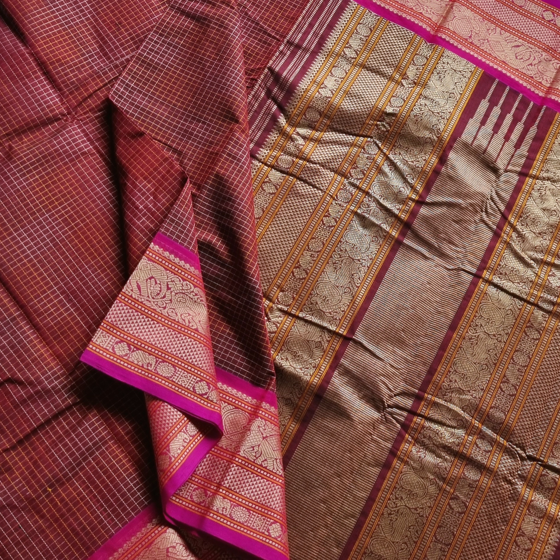 Kanchi Cotton maroonish brown checked saree with intricate borders