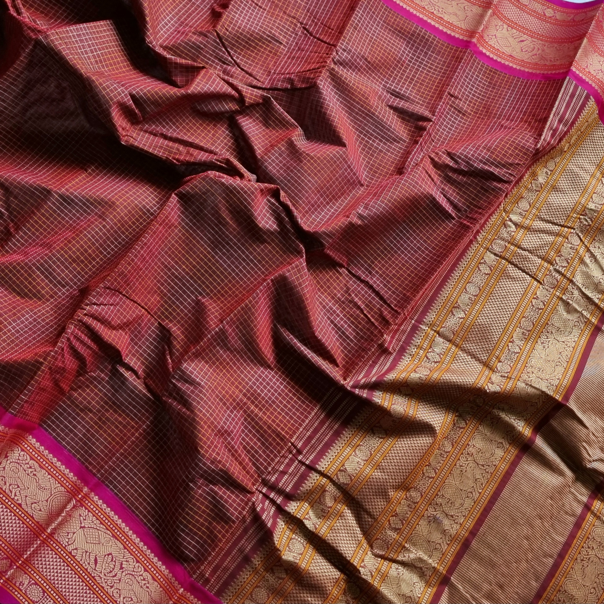 Kanchi Cotton maroonish brown checked saree with intricate borders