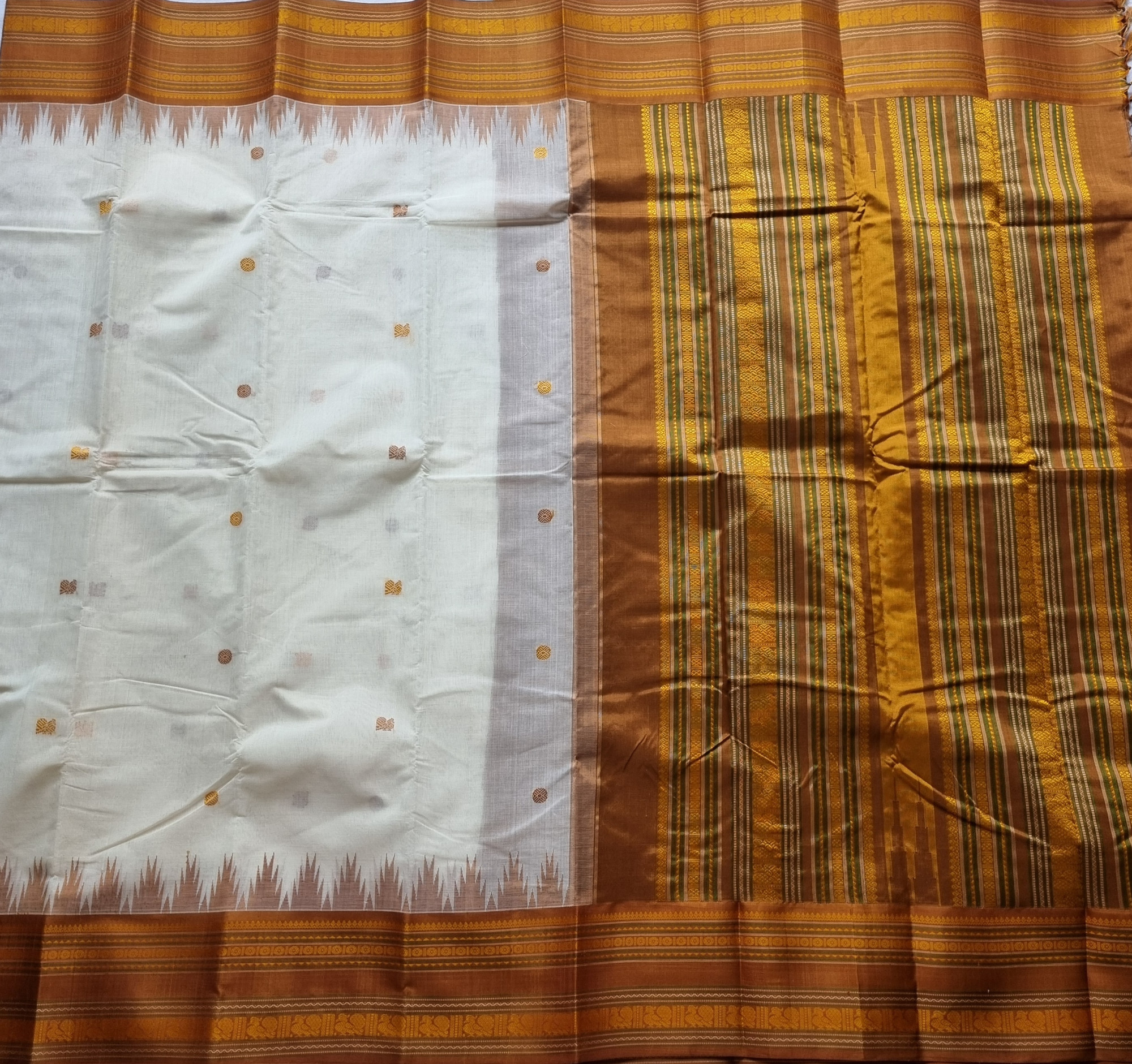 Kanchi Cotton body offwhite with bronze Korvai Silk Borders