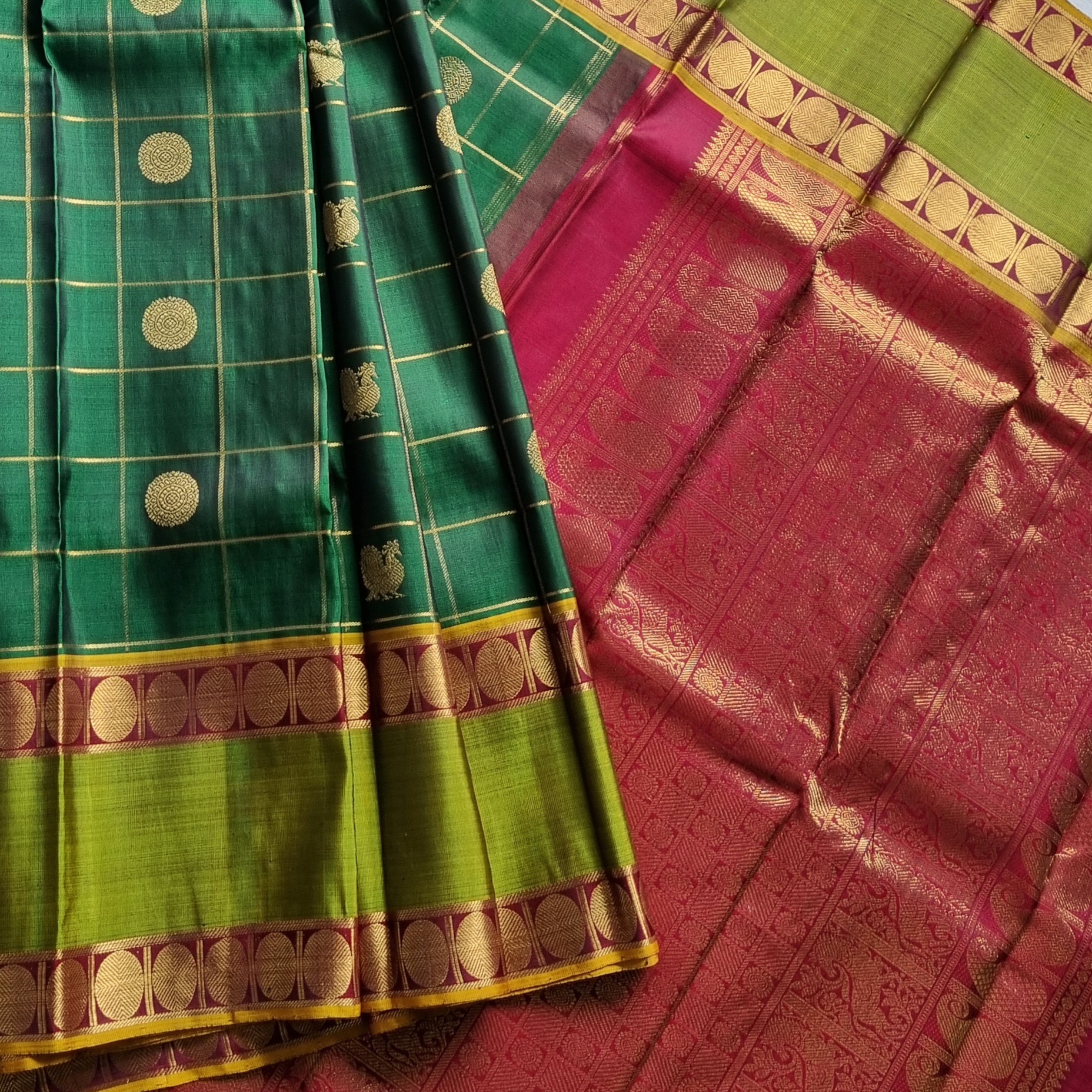 Kanjivaram Silk gorgeous dark green Mayil Chakram