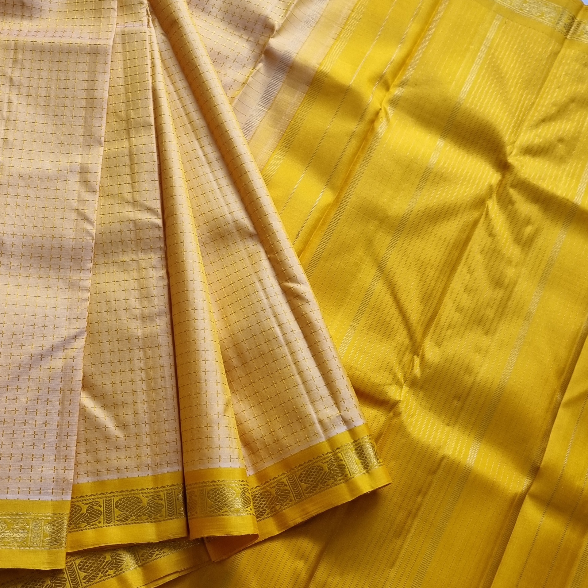Kanjivaram Silk golden  with plus buttas