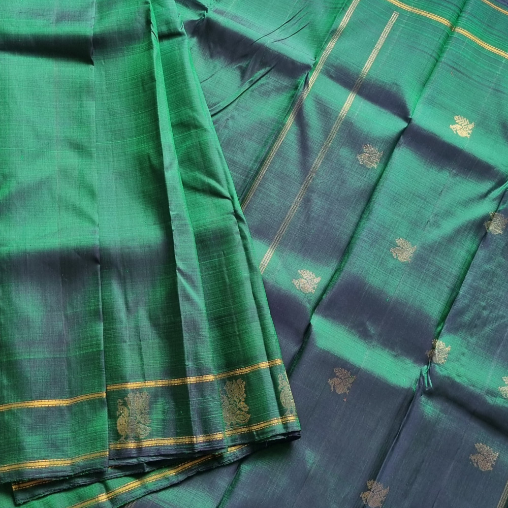 Image of Maragathavalli : Vintage Revival Kanjivaram Silk shot deep emerald green