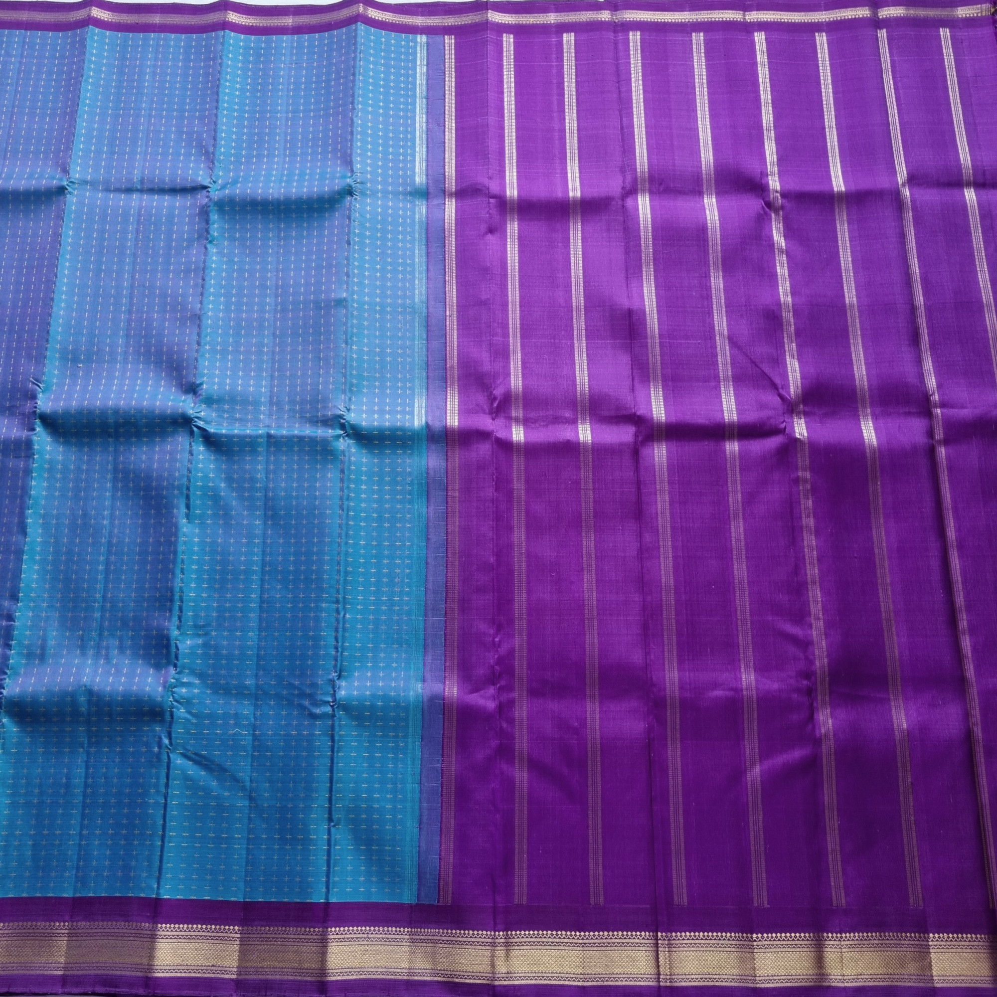 Kanjivaram Silk shot blue with plus buttas