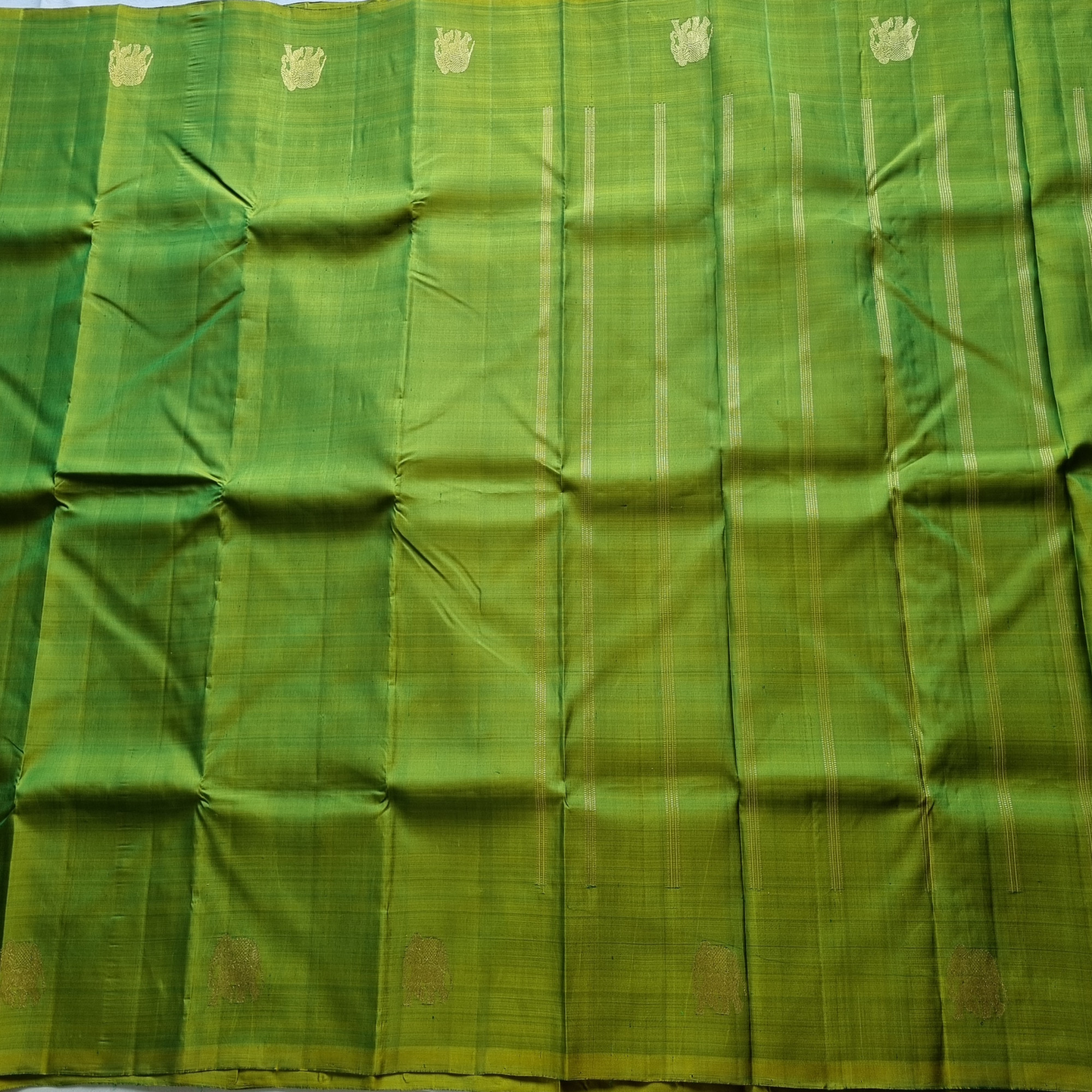 Kanjivaram Silk shot green with elephant buttas
