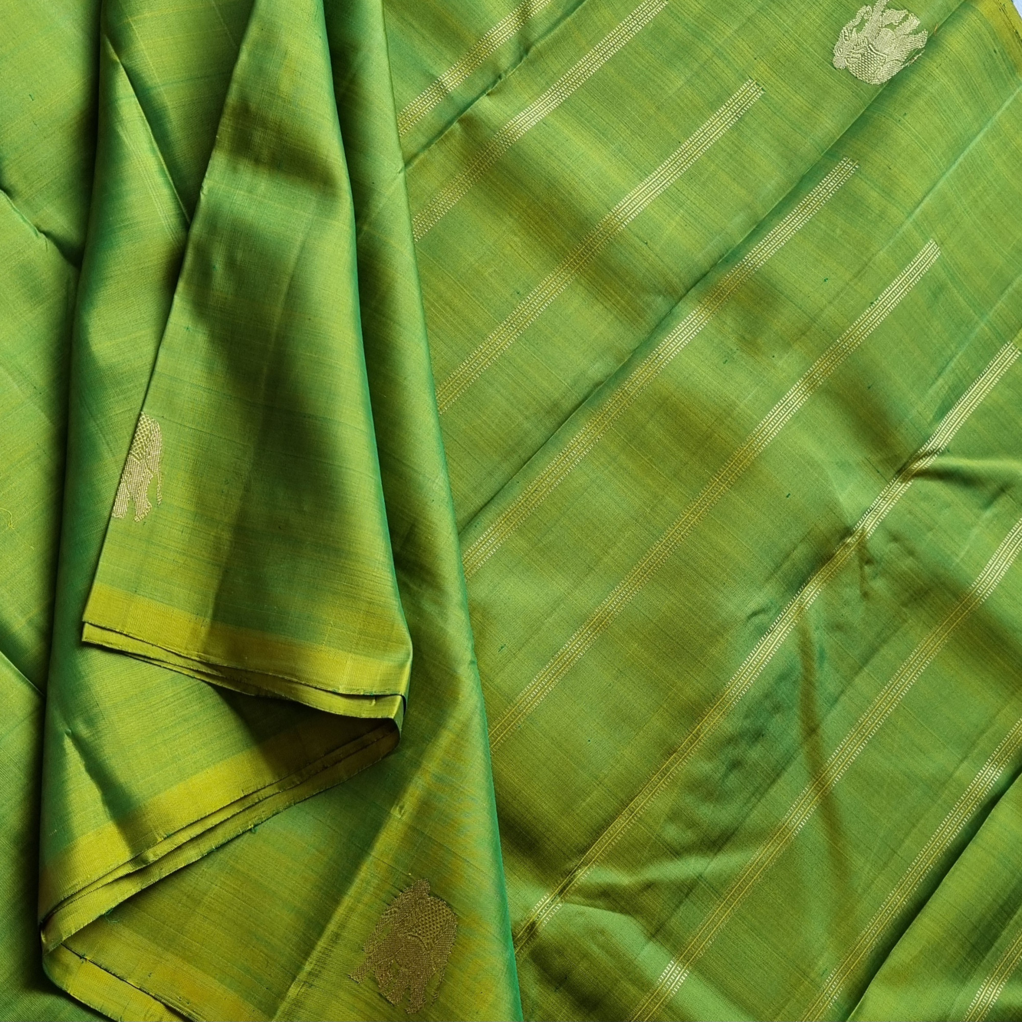 Kanjivaram Silk shot green with elephant buttas
