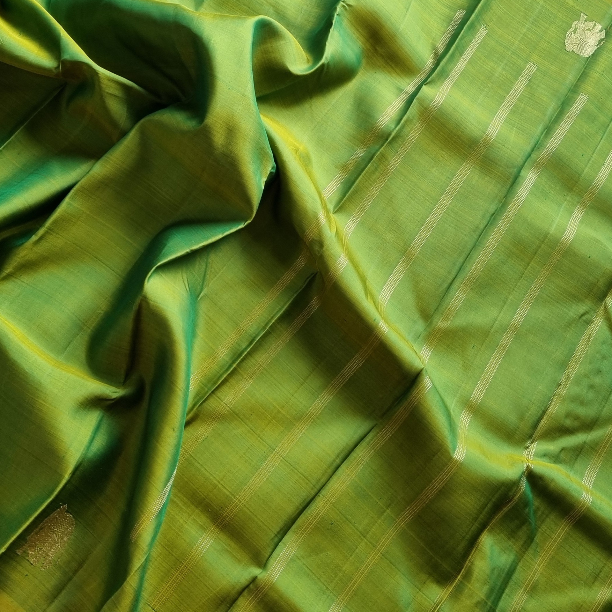 Kanjivaram Silk shot green with elephant buttas