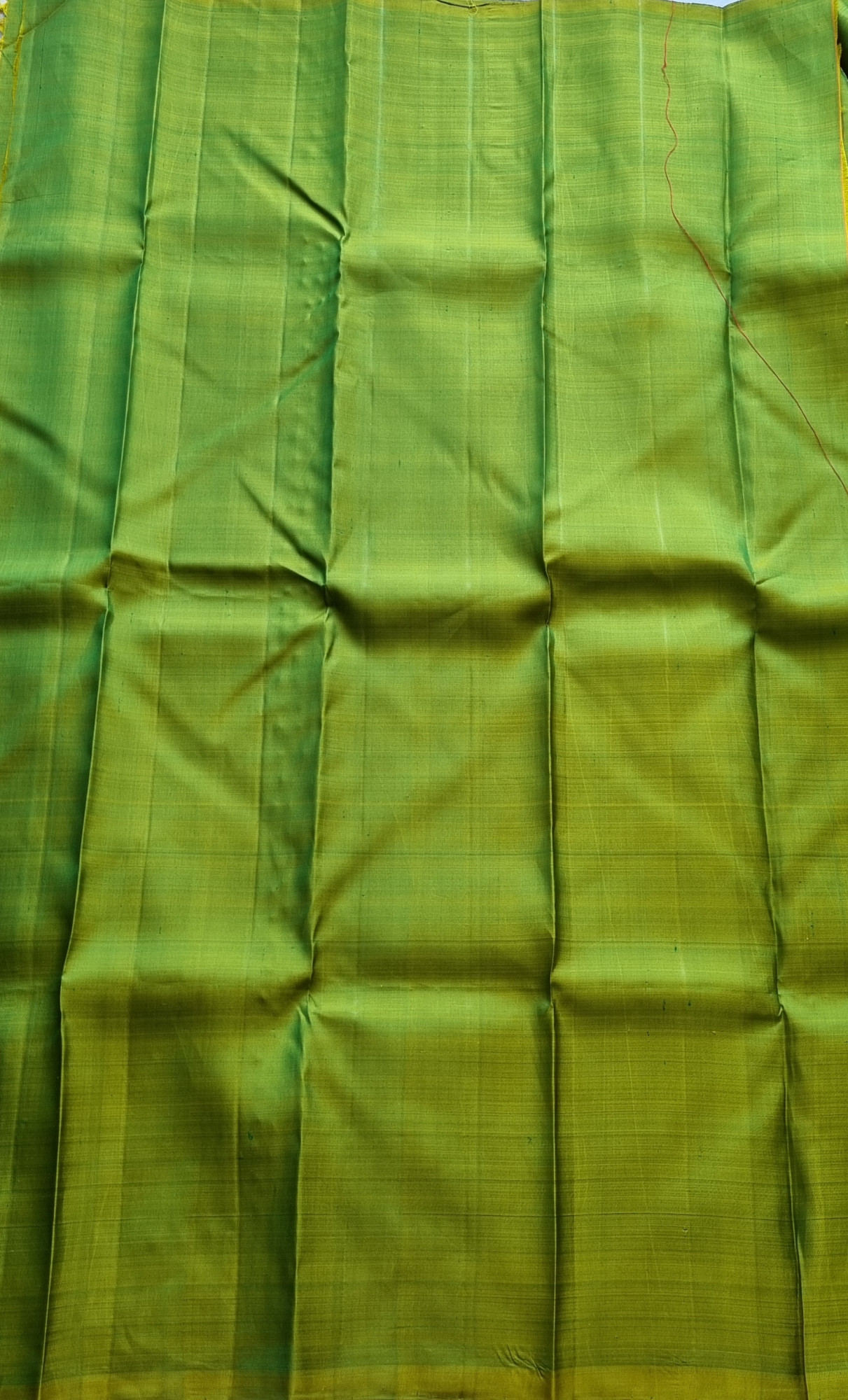 Kanjivaram Silk shot green with elephant buttas