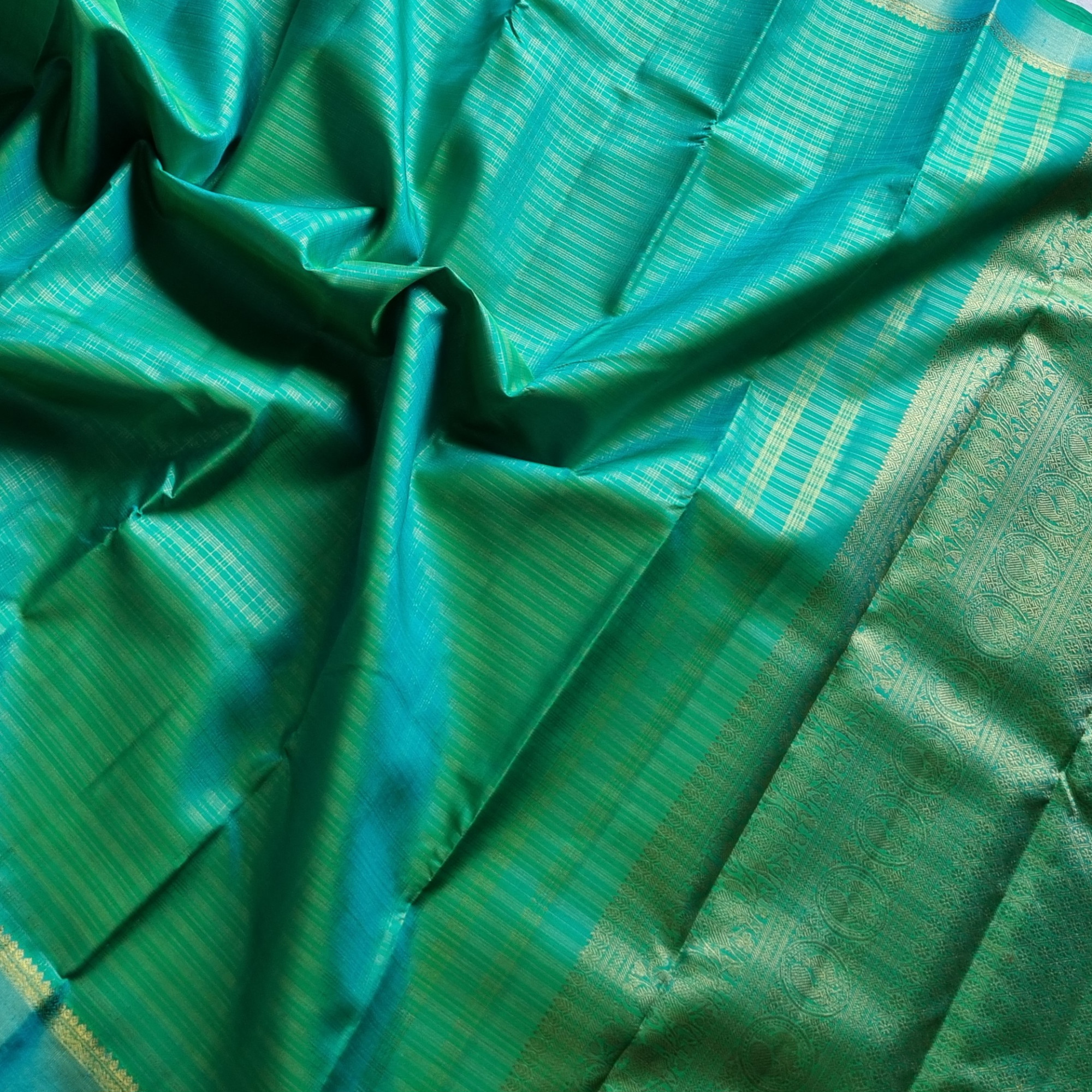 Kanjivaram Silk Splendid shot sea with all over  zari grids