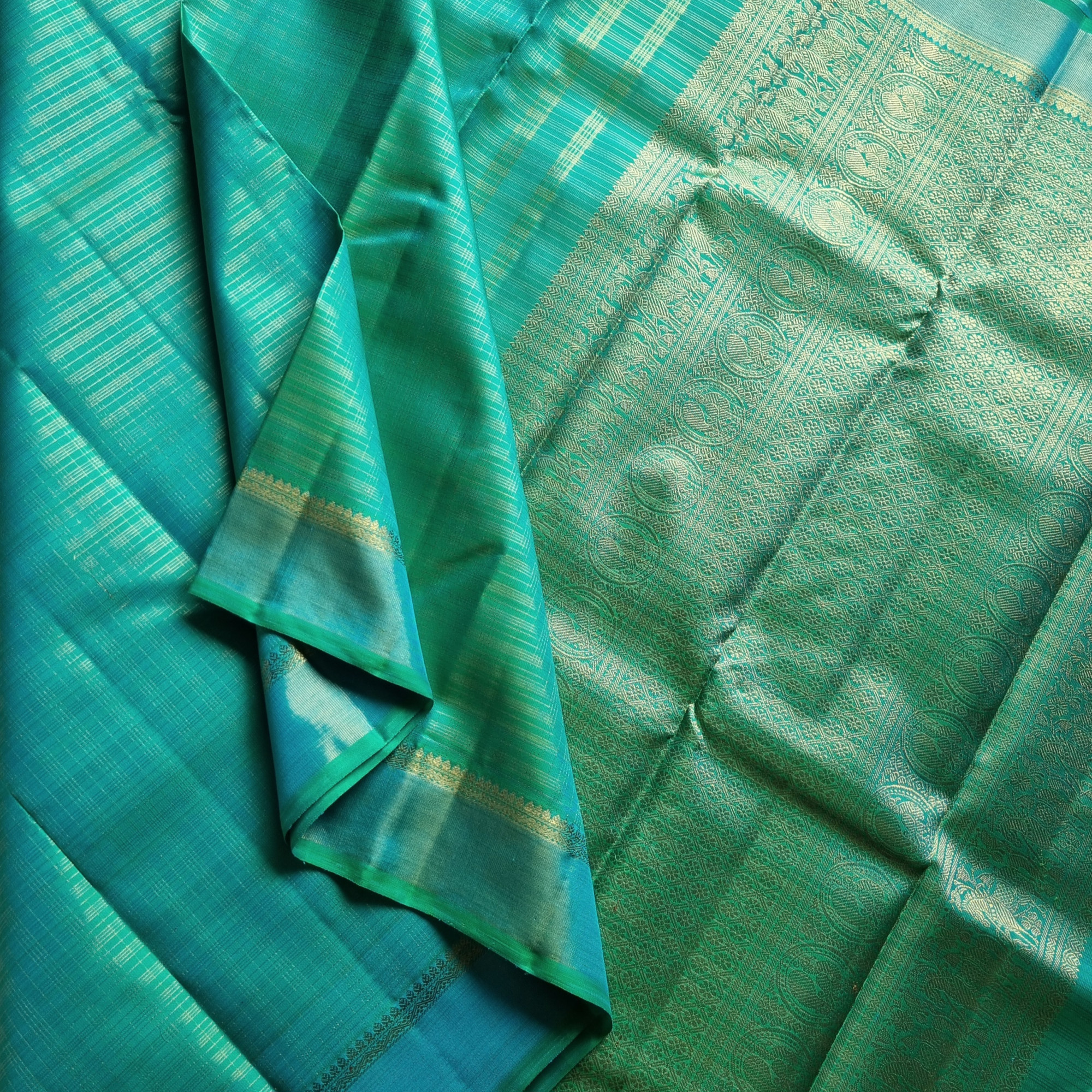 Kanjivaram Silk Splendid shot sea with all over  zari grids