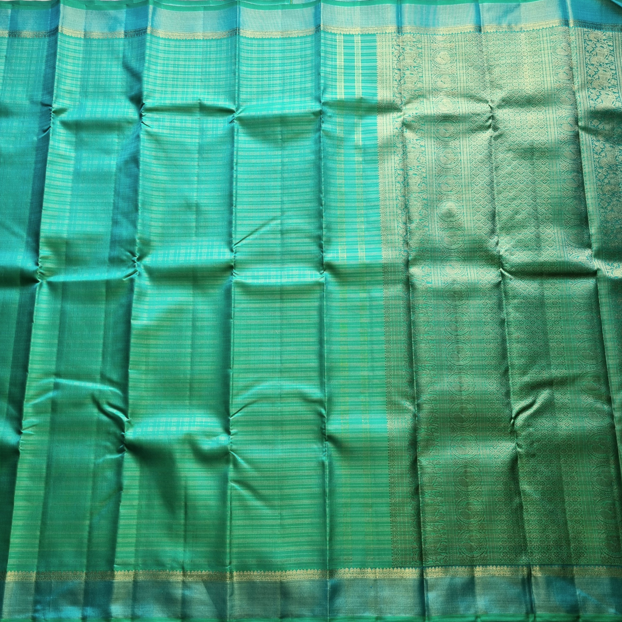 Kanjivaram Silk Splendid shot sea with all over  zari grids
