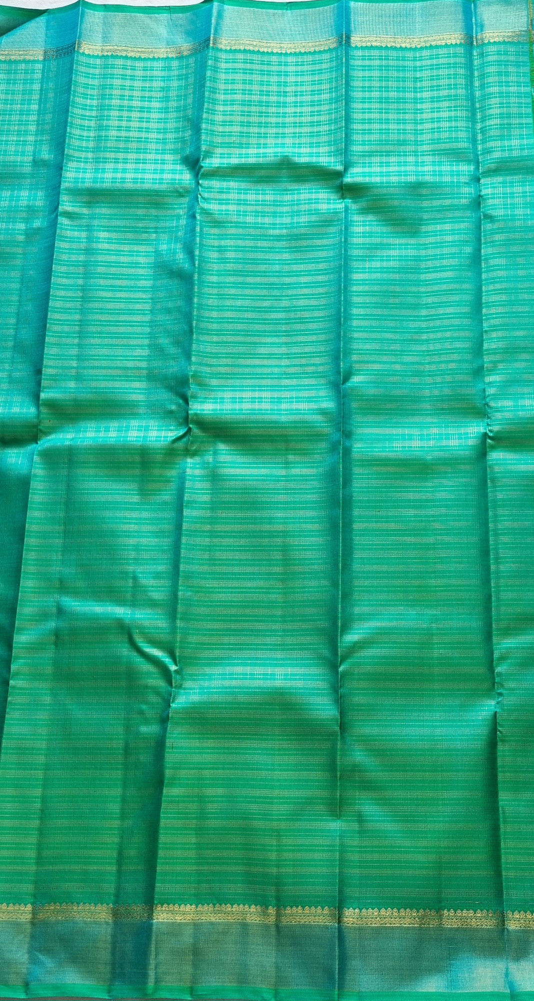 Kanjivaram Silk Splendid shot sea with all over  zari grids