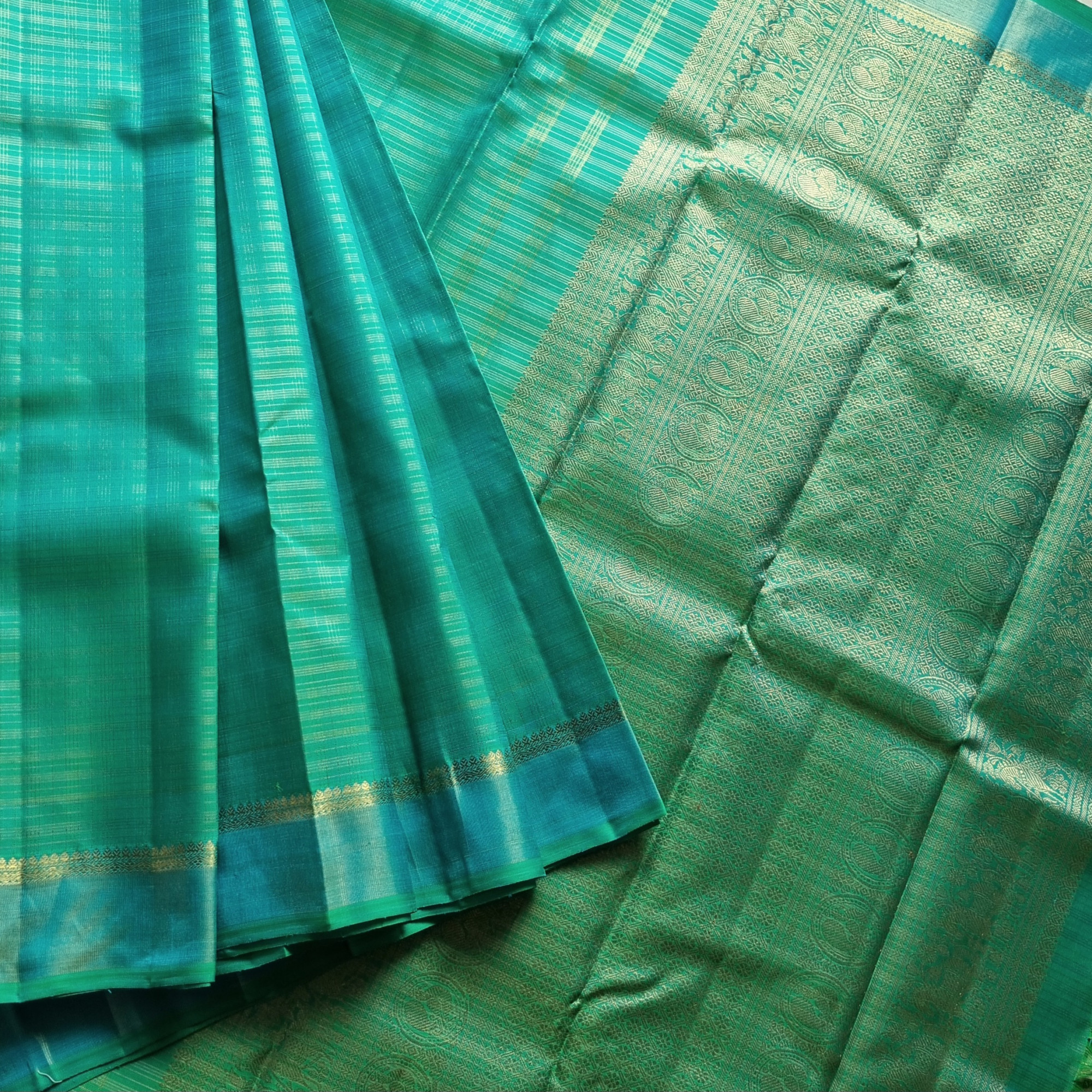 Kanjivaram Silk Splendid shot sea with all over  zari grids