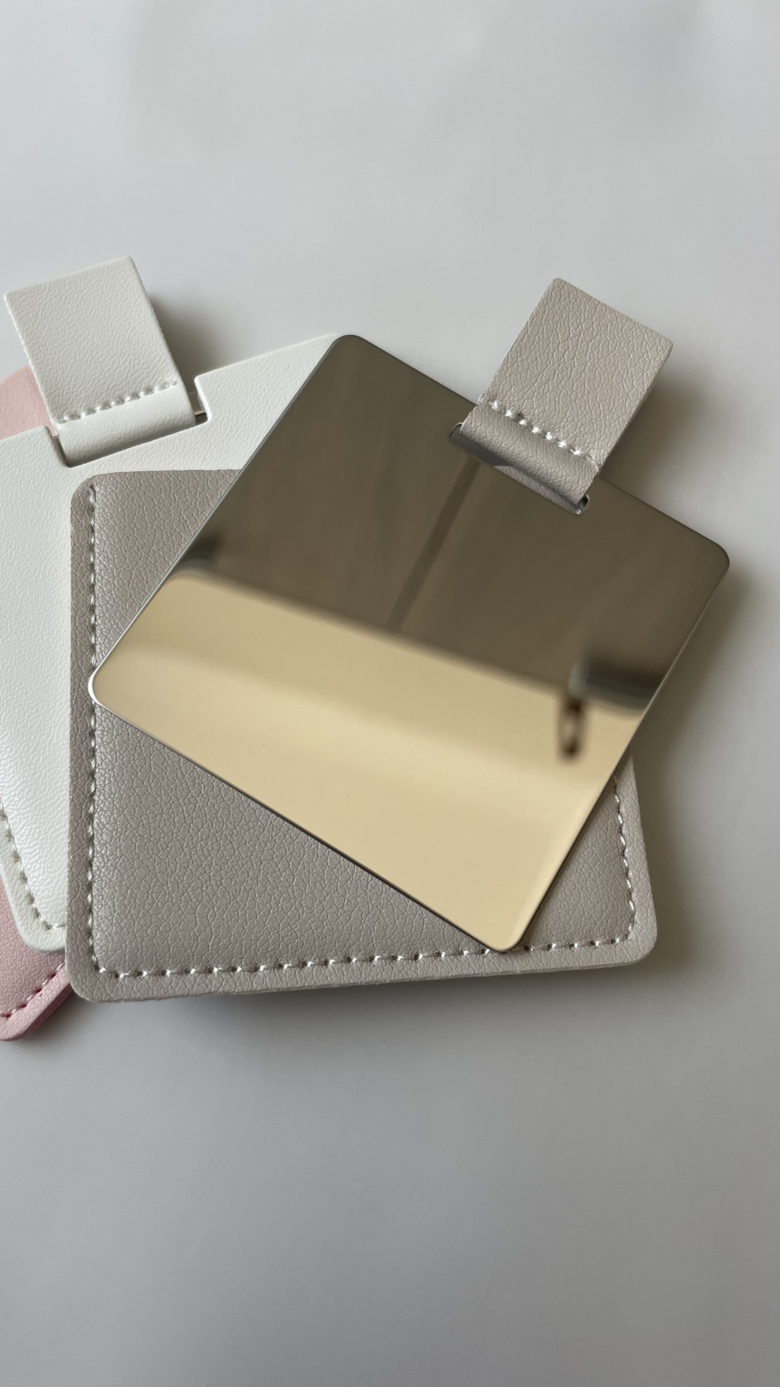   - Small leather mirror