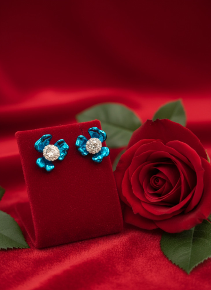 Image of Azure Bloom: Crystal-Encrusted Sky Blue Flower Stud Earrings