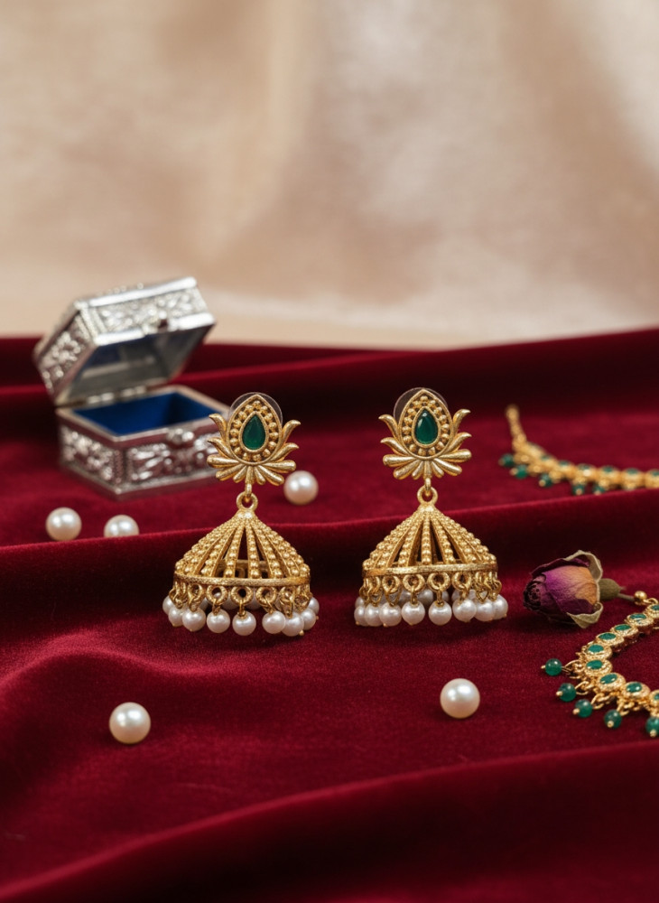 Image of Traditional Gold-Plated Green Stone Studded Pearl Jhumka Earrings for Festive &amp; Wedding Wear.