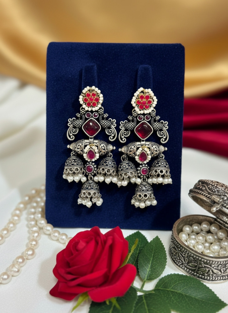 Image of Traditional Oxidized Silver Triple Layer Jhumka Earrings with Red Stones