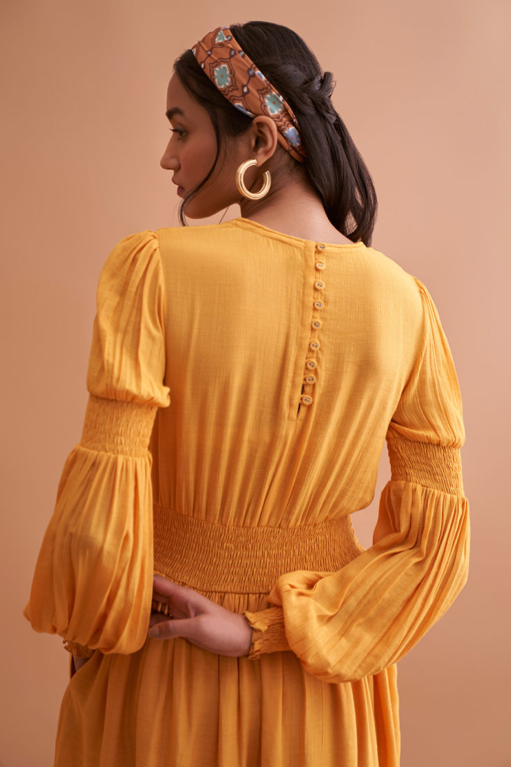 AMALFI SOLID YELLOW TEXTURED RAYON CREPE KNEE LENGTH DRESS WITH HAND EMBROIDERED NECK