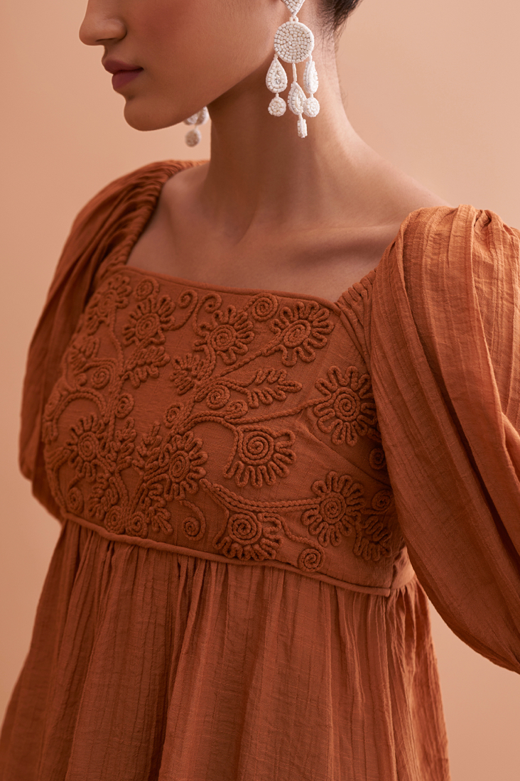 AMALFI SOLID BROWN RAYON CREPE TEXTURED FABRIC SUMMER TOP WITH SHORT SLEEVES AND EMBROIDERED NECK